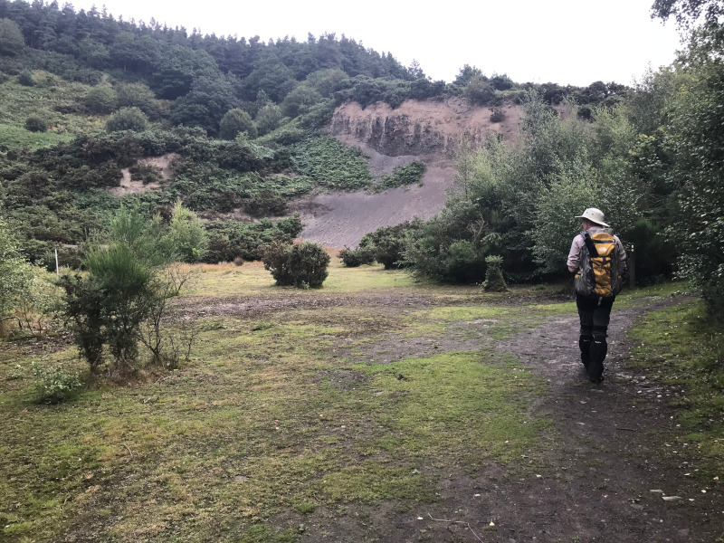 B. at the foot of an Alum Quarry