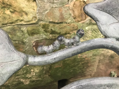 Detail of the vine sculpture consisting of a caterpillar.