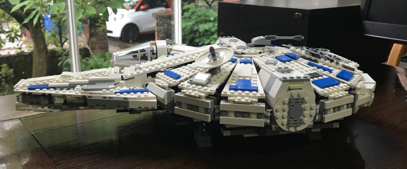 A Lego Millenium Falcon (side view). Looking pretty much as it does in the movies, except there is a new block between the two sticky-outey bits at the front.
