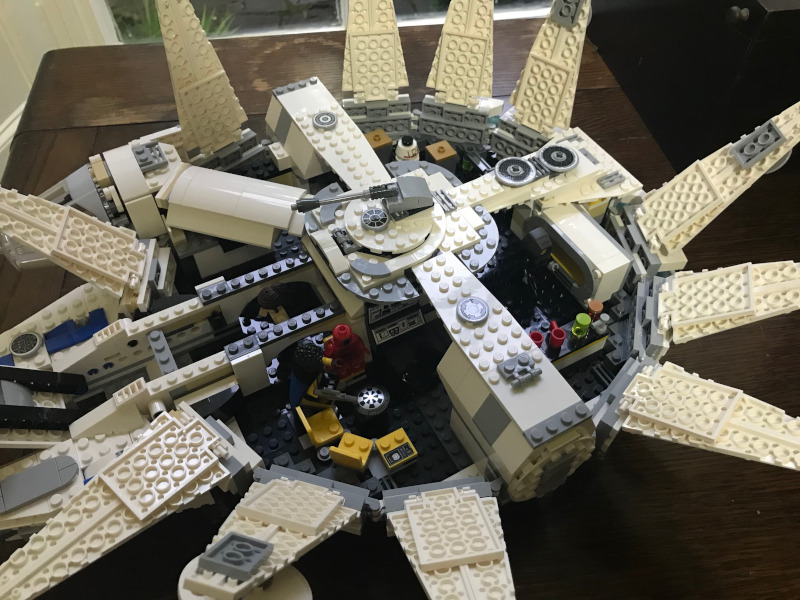 Lego Millenium Falcon viewed from the top. All the top panels have swung back to reveal the interior.