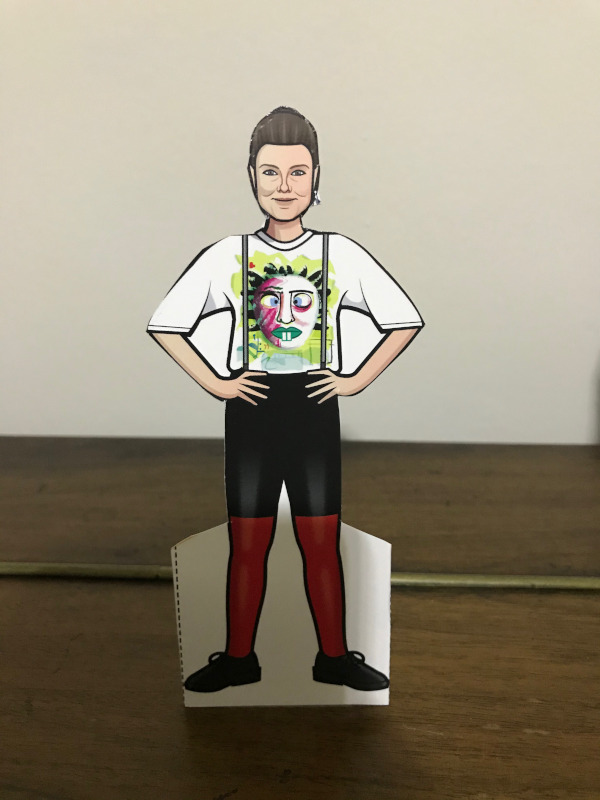 Ace Paper doll wearing black shorts, red leggings, braces and a T-Shirt.