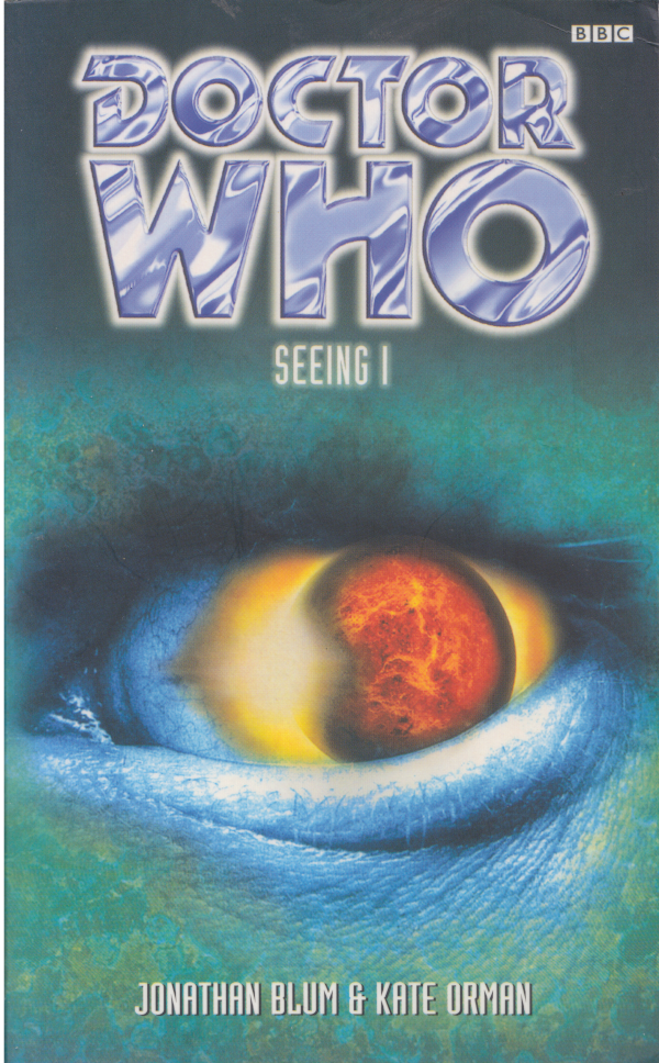 Book Cover for the BBC book Seeing I.  Close up of an eye.  The pupil is a red sun/planet surrounded by yellowfins.  The face is blue and green.
