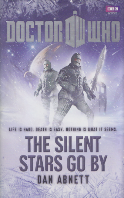 Book cover for The Silent Stars Go By by Dan Abnett:  Two Ice Warriors in the Snow.  Tagline: Life is Hard, Death is Easy, Nothing is What it Seems.