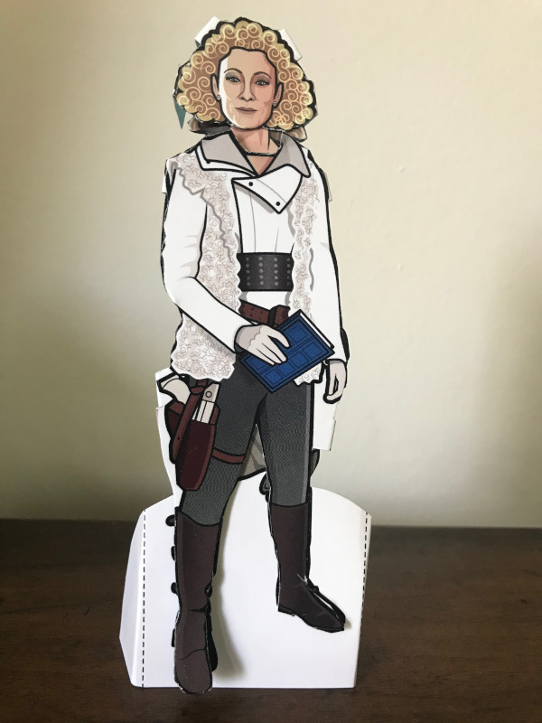 Paper doll of River Song in her white jacket outfit from the Pandorica Opens
