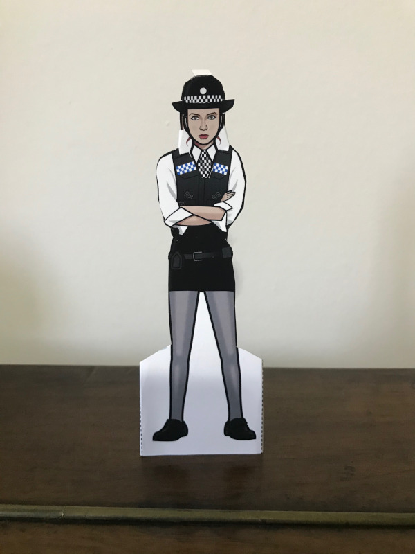 Amy in her `police` outfit.  Hair up under her hat - some white card to cover the long hair of the doll underneath.