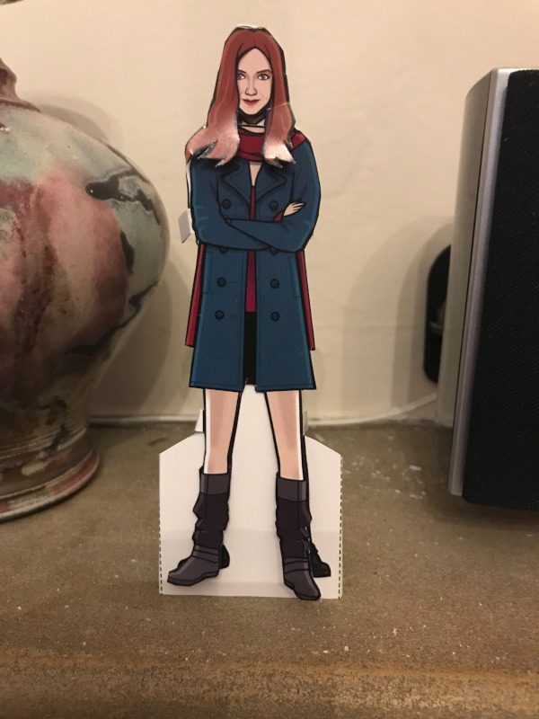 Amy Pond paper doll in her blue coat, boots and red scarf look.