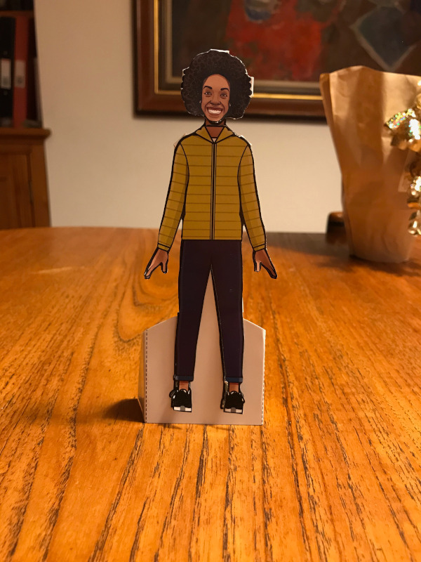 Paper Doll of Bill Potts in her yellow puffer jacket and rolled up jeans.