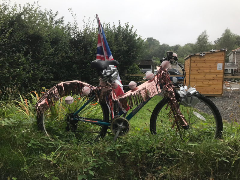 Bicycle draped in coppery shining fringing