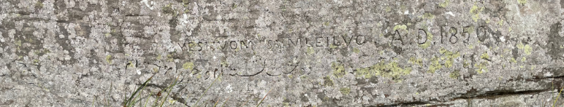 Graffiti on a rock.  Persian and latin lettering can be made out plus the date 1850.