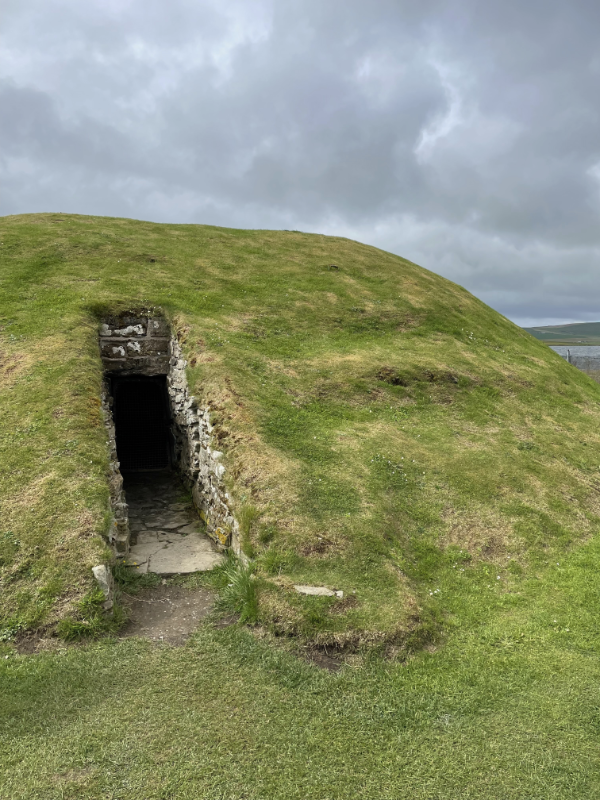 Outside the grassy mound, showing tunnel entrance.