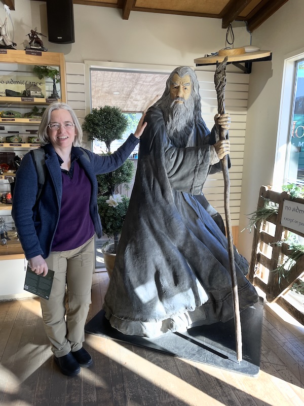 Me standing next to a stature of Gandalf.