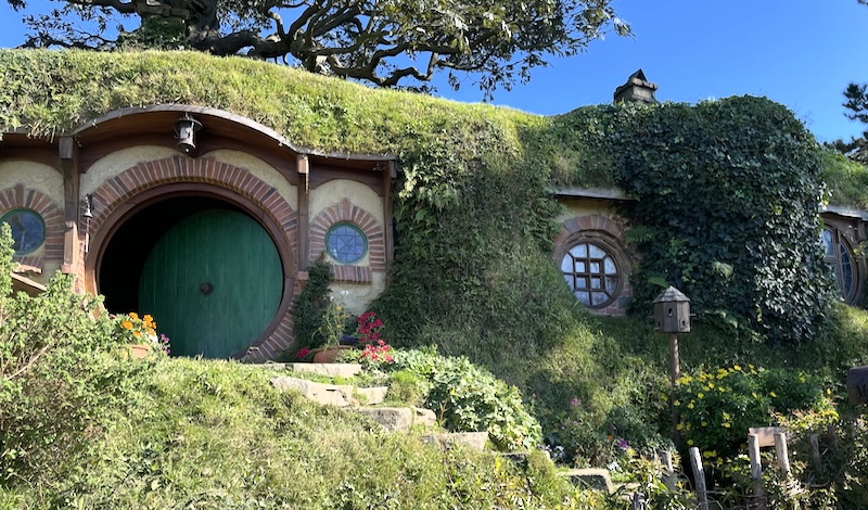 The door to Bag End on the left, showing its windows to the right.
