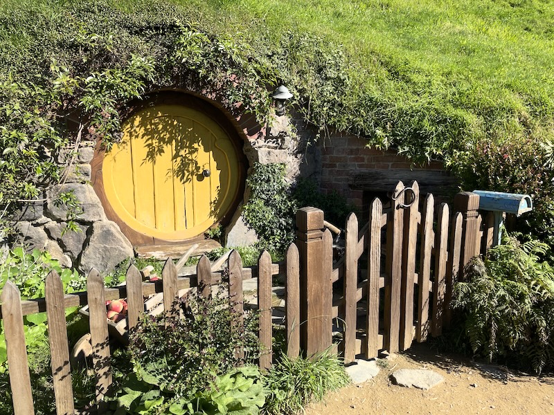 A hobbit hole with a yellow door.