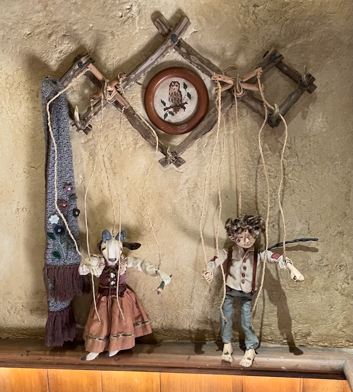 Puppets of a lady mouse and a boy.