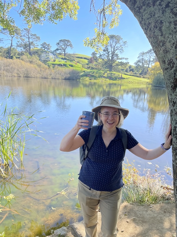 Me with my ale. The lake and Hobbiton in the background.
