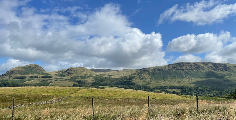 View of hills under a blue sky