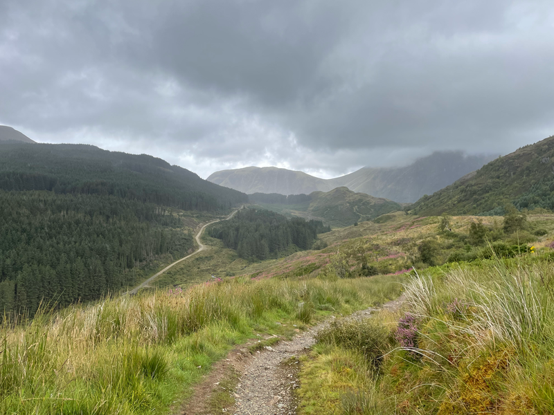 View of a winding track between mountains.