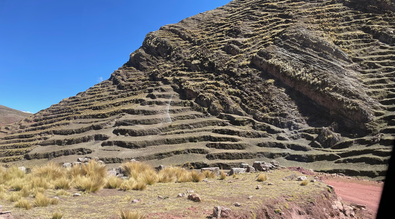 A mountain side which has folds looking like terraces.