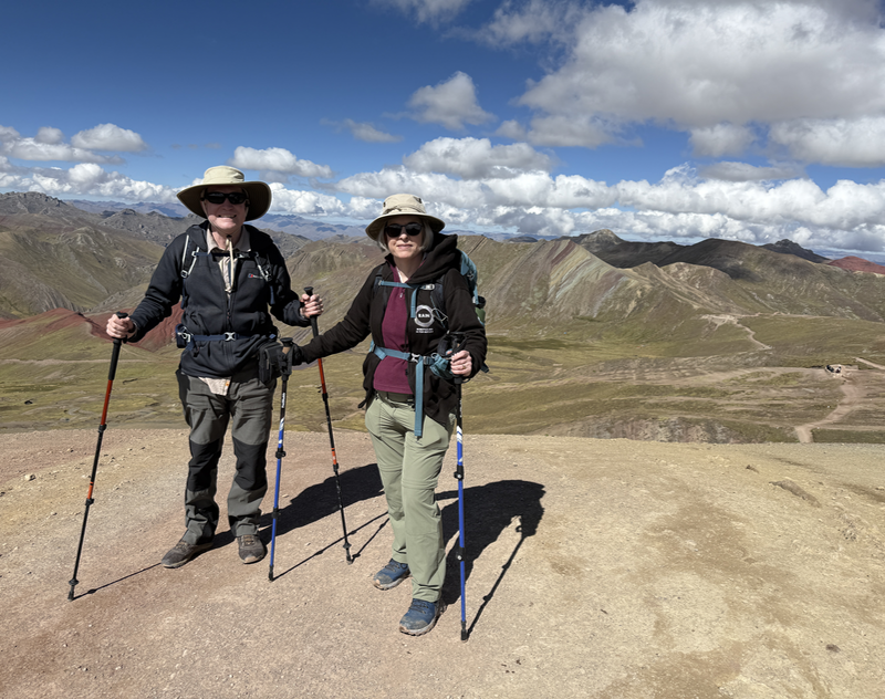 Me and B with mountains behind, one of which has stripes.