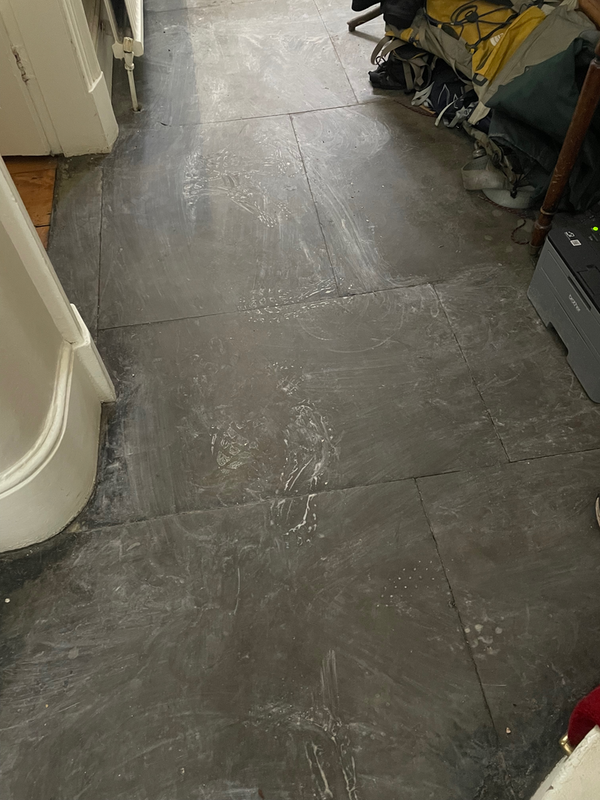 White plastery footprints on a hall floor