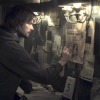 Jonas, older version, looking at the picture wall from Dark.