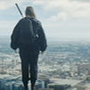 Ace, back view, standing on top of UNIT HQ with her bat on her back.
