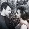 Ian and Barbara looking at each other and smiling.  Slight colour wash.