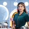 Belinda in the Tardis. Waist up in a blue jumpsuit