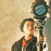 Chang Lee from Doctor Who the TV Movie holding a big mirror on a stick