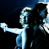 Elven and River back to back.  River pointing a gun.