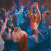 The Fifteenth Doctor, in a kilt, dancing in a night club.