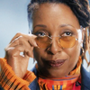 The Fugitive Doctor looking over her glasses.