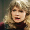 Jo from Doctor Who in a red polo neck.