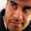 Close-up of the face of the Dhawan Master.  Slight smile.