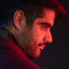 Dhawan Master in profile lit red.