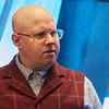Nardole, head and shoulders shot in a waistcoat.