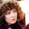 Nyssa with very curly hair with hair pin.