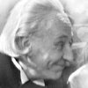 B&W icon of the first doctor looking pleased with himself