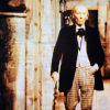 Sepia toned icon of the first doctor walking down a street.