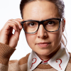 Osgood from Doctor Who, taking off her glasses.  Question mark collar.