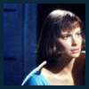Peri in blue leotard.  Head and shoulders looking left.