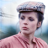 Romana 1 in a flat cap.