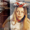 Romana in a tricorn-ish had with floral decoration.  A dark stripe effect down the right.