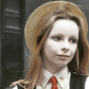 Romana 2 with a straw hat and red tie.