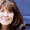 Sarah from the new series.  Tardis door in background.
