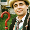 The seventh doctor.  Brown Coat, head and shoulders, with question mark umbrella.