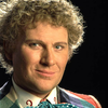 The Sixth Doctor - head shot against a black background