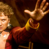 The Sixth Doctor - only half of him hand stretched up and forward