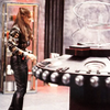 Kate O'Mara as the Rani.  Side shot standing next to her Tardis console.