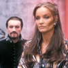 Kate O'Mara as the Rani looking mildly annoyed.  The Master stands behind her.